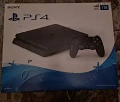 ps4 slim 1TB with box and two controller and original cables