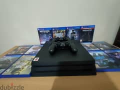 PS4 إماراتي pro 1TB with library of games  ومعاه دراعين