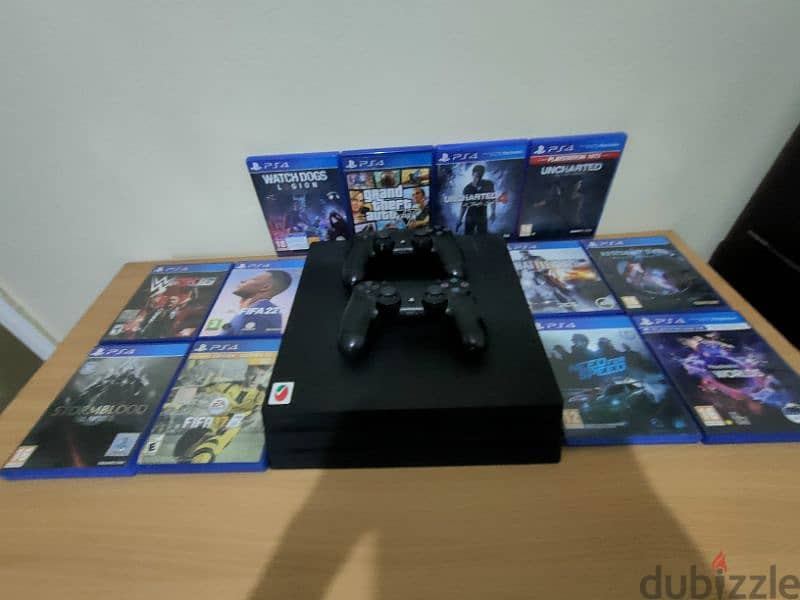 PS4 إماراتي pro 1TB with library of games  ومعاه دراعين 1