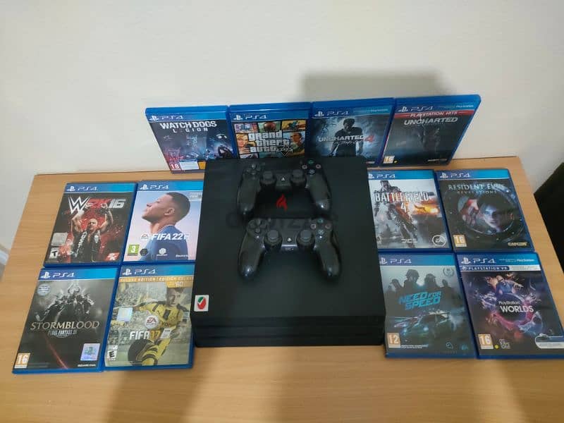 PS4 pro 1TB with library of games have 2 controller 4