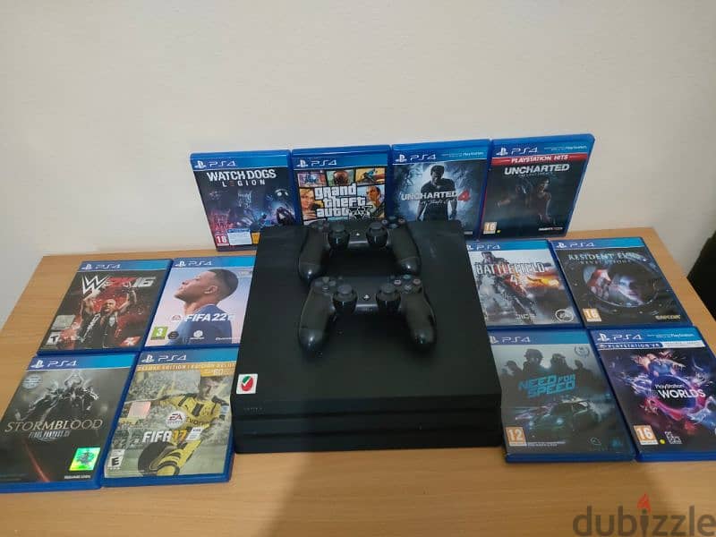 PS4 إماراتي pro 1TB with library of games  ومعاه دراعين 5