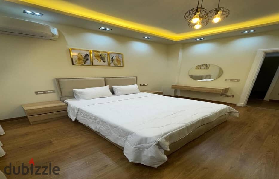 Luxurious fully furnished apartment with garden for rent in Eastown Sodic compound new Cairo fifth settlement 5