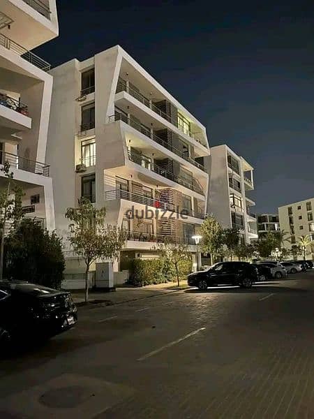 In front of Gardenia Apartment  for sale in installments in Taj City Egypt City 2