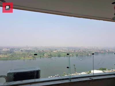 apartment on the Nile with furnishings and air conditioners, hotel service in installments, and cash is available at a special discount,