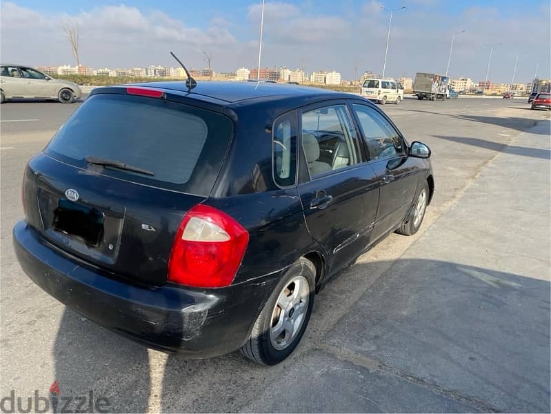 Kia Cerato 2005 فبريكا برا و جوا 4