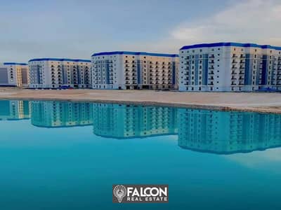 Ready to move in with a down payment of 750 thousand, a fully finished sea view apartment ((immediate delivery)) in the heart of New Alamein, North Co