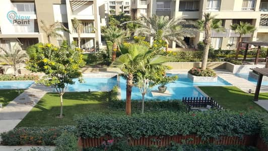 Apartment with garden for sale in Swanlake Hassan Allam Compound in the heart of the first settlement, directly in front of Rehab