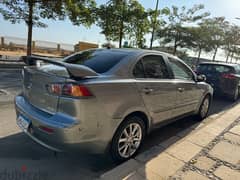 Mitsubishi Lancer 2015 بصمة و فتحة سقف