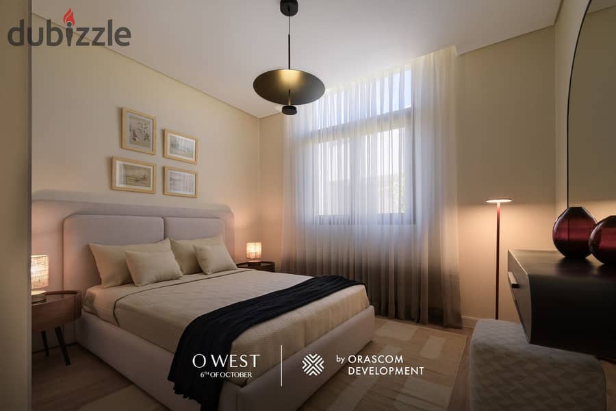 Own a villa in O West with a 400 sqm area and a 7-year installment plan, in a prime location directly on Wahat Road. 26