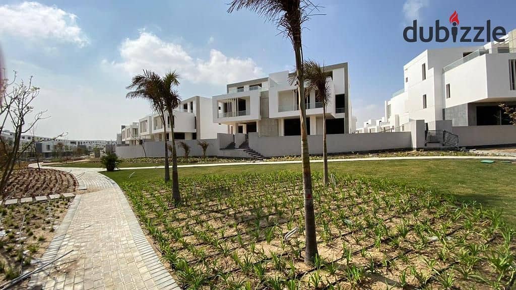 A standalone villa with a massive area featuring 6 master bedrooms, located in front of ESLSCA University and New Giza. 13