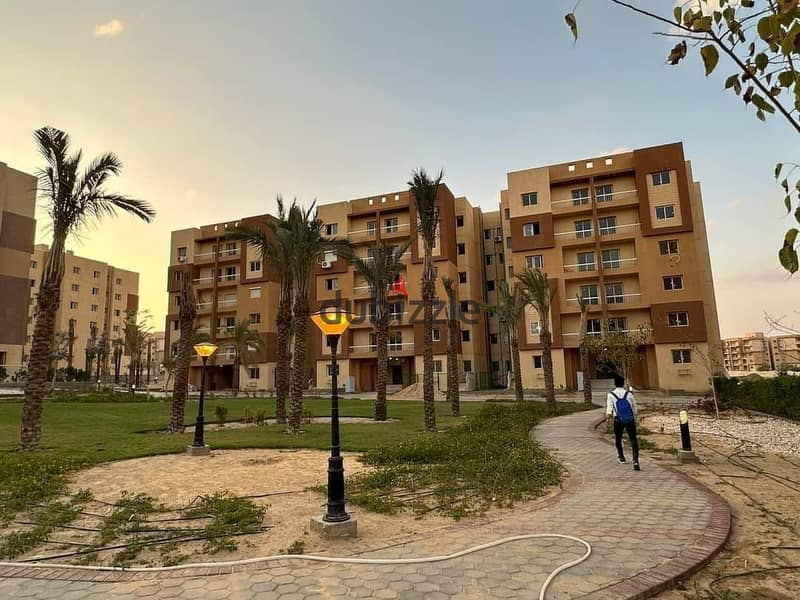 Apartment for sale in Ashgar City, with a view of green spaces and landscape, third floor, semi-finished, fastest delivery 11