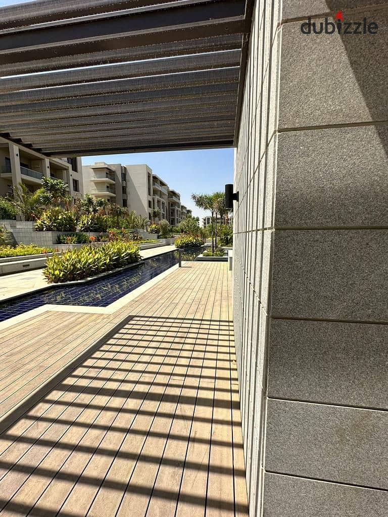 Fully finished apartment for sale 121m2 with 2 bedrooms in a compound with green spaces and perfect landscaping in the heart of the 5th settlement 11