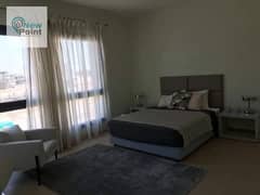 Apartment with garden for sale in Swan Lake Compound on Suez Road in front of Rehab