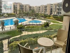 For sale, an apartment with immediate delivery, 133 m, next to the American University AUC, in a fully serviced compound in the Fifth Settlement