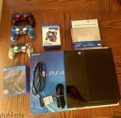 PS4 fat + 3 joysticks + 5 games + Charger doc