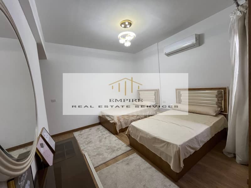 Fully Furnished Apartment with ACS' in Marasem Open View with amazing Price with everything - Looking into green areas 7