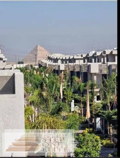 Receive immediately, with a 10% DP, a two-bedroom apartment with a view of the pyramids