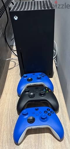 xbox series x with 3 controllers