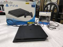 Playstation 4 Slim 500 GB with 2 Controllers and 4 Games