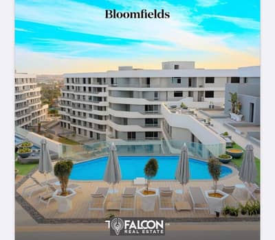 Fully finished apartment near the American University, with installments over 10 years and delivery soon, ready for inspection in Bloomfields Compound