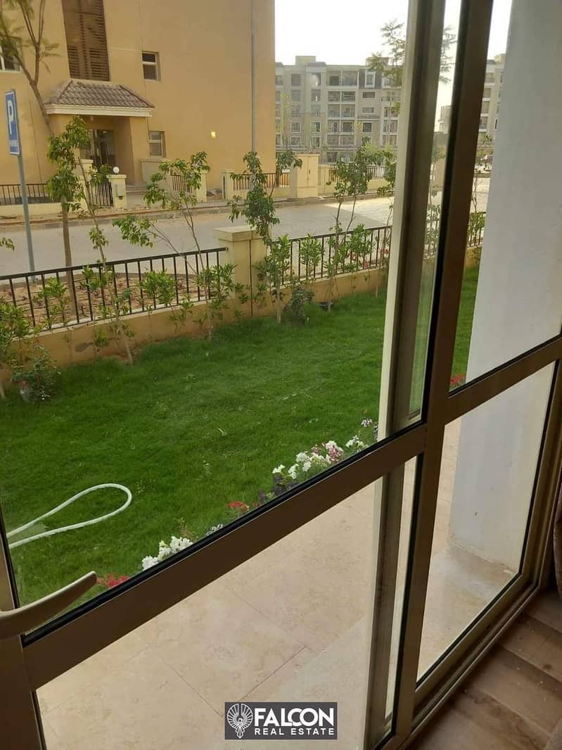 For sale, an apartment with a garden, with a 42% discount for cash + installments, next to Madinaty, in Sarai Compound, on the Suez Road 9