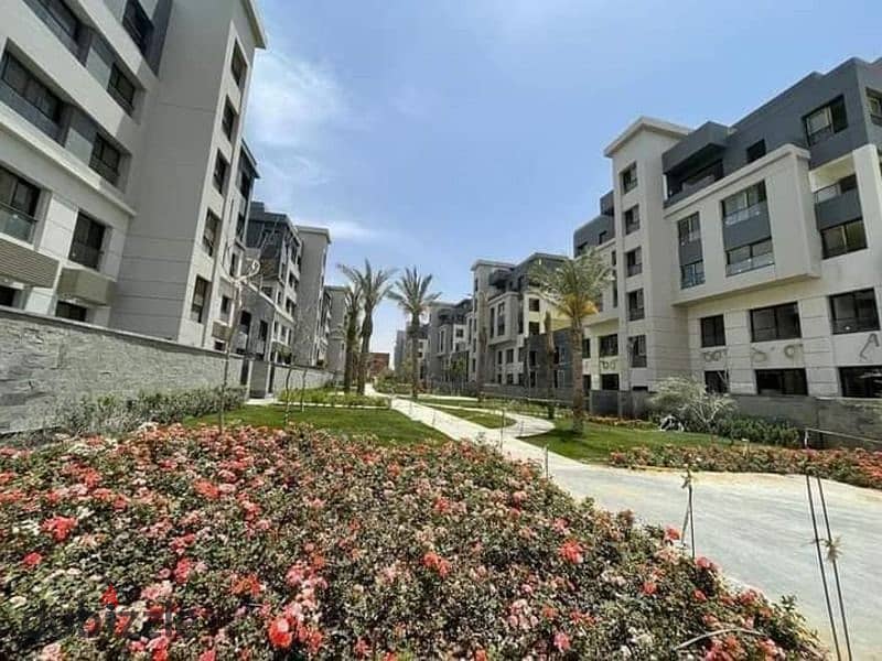 Apartment with garden for sale in Trio Garden compound fully finished prime location with a view of the landscape 5