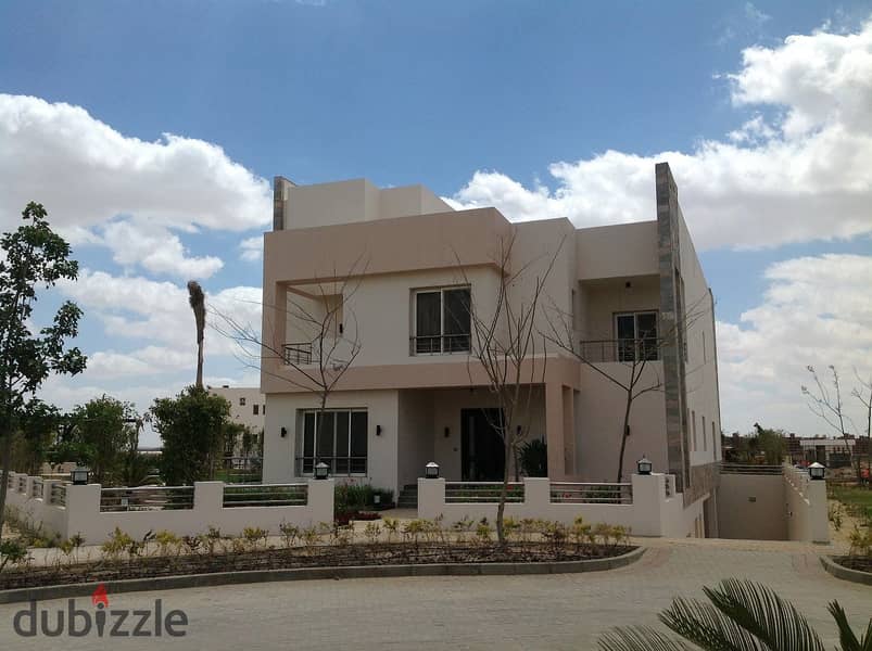 For sale, an independent villa in Grand Heights Compound, a special location inside the compound, on the landscape, next to Mountain View, near Sheikh 3