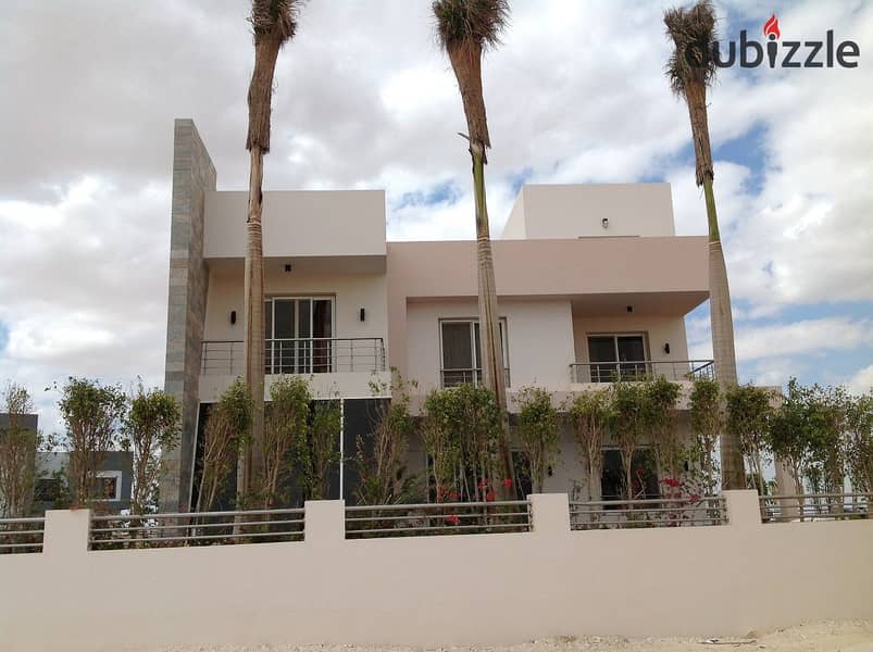 For sale, an independent villa in Grand Heights Compound, a special location inside the compound, on the landscape, next to Mountain View, near Sheikh 5