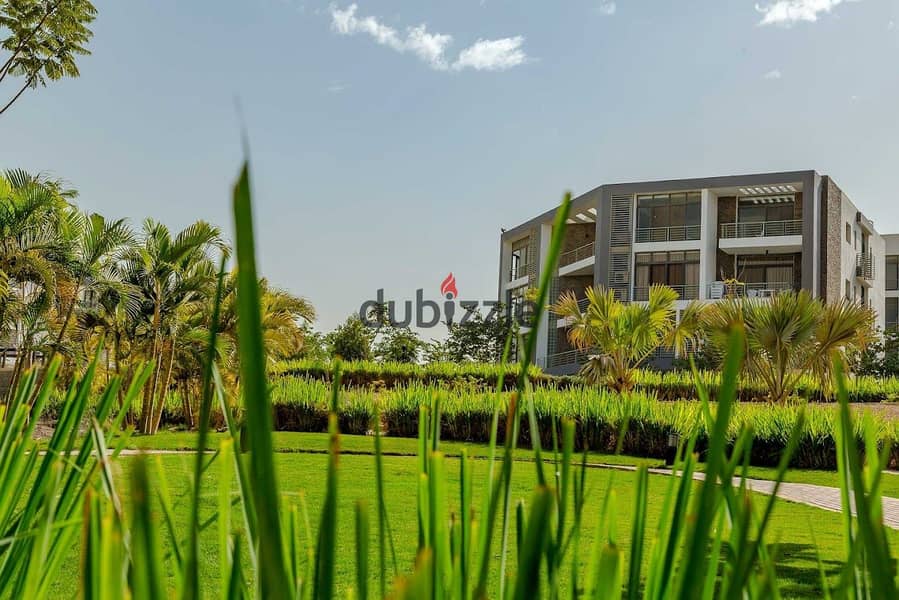 With a cash discount, I own an apartment in a garden in Taj City in front of Cairo International Airport 1