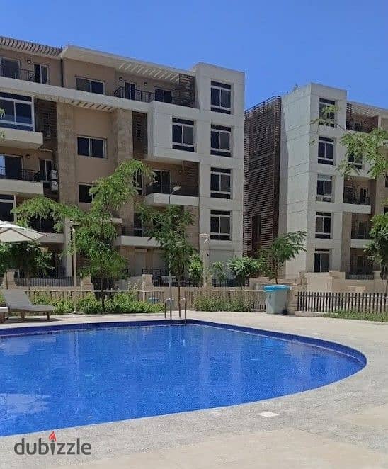 With a cash discount, I own an apartment in a garden in Taj City in front of Cairo International Airport 5