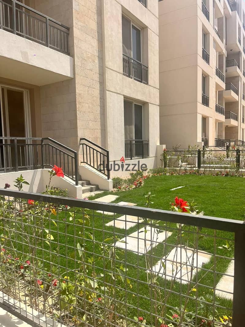 Ground floor apartment with garden for sale in Tag City Compound 8