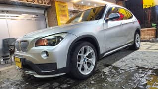 BMW X1 2013  فابريكا بالكامل عدا رفرف