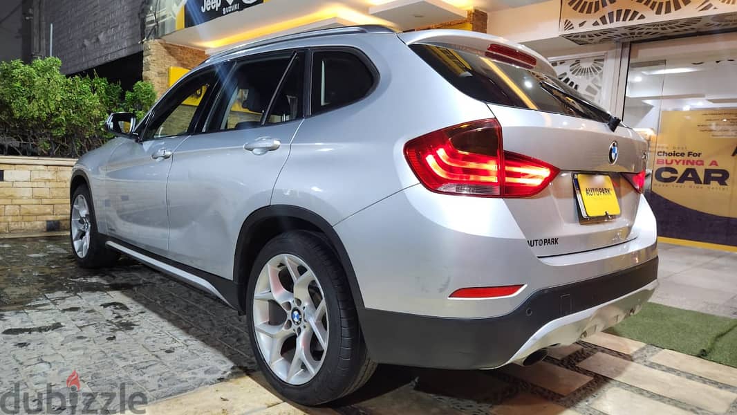 BMW X1 2013  فابريكا بالكامل عدا رفرف 19