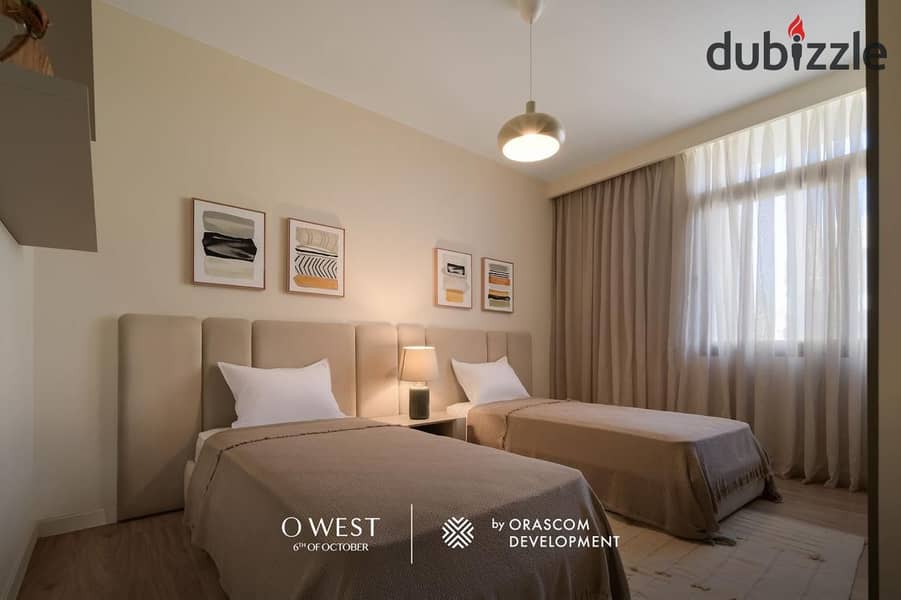 Apartment for sale at the lowest price in O West Compound by Orascom Company, delivery in one year, super deluxe finishing 8