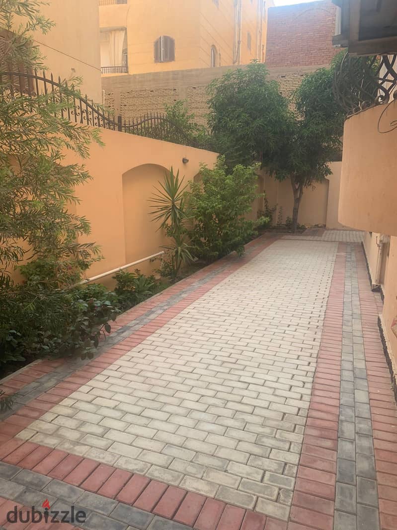 For sale in Sheikh Zayed, the largest ground floor apartment with a garden. It directly overlooks the main street of Al Yasmine Compound 2