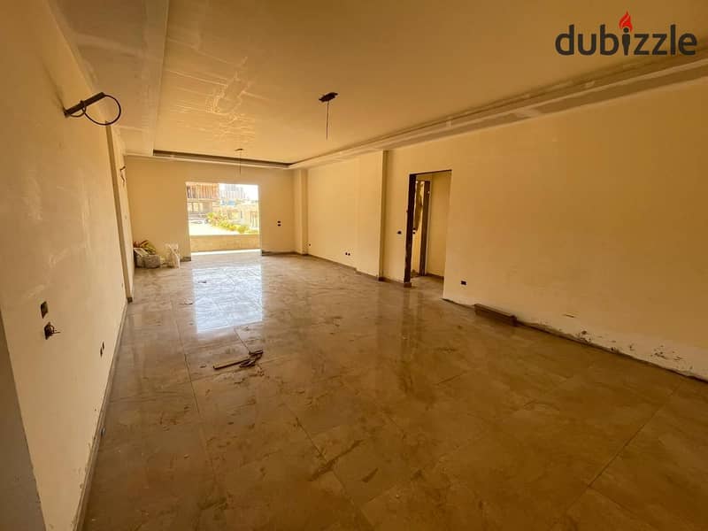 A fully finished apartment with a spacious area, landscape view, located in front of Al Ahly Club. 2