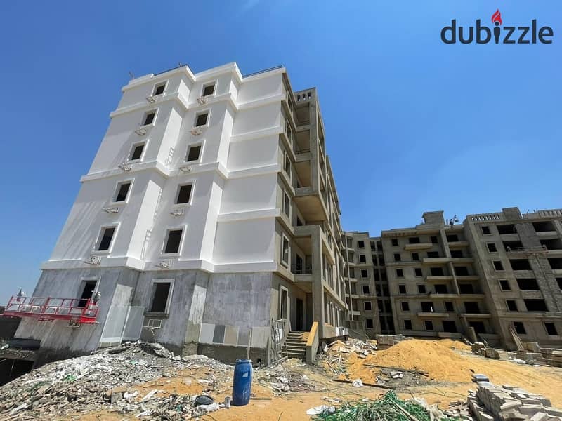 A fully finished apartment with a spacious area, landscape view, located in front of Al Ahly Club. 7