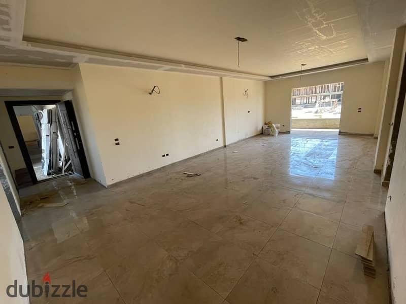 A fully finished apartment with a spacious area, landscape view, located in front of Al Ahly Club. 9