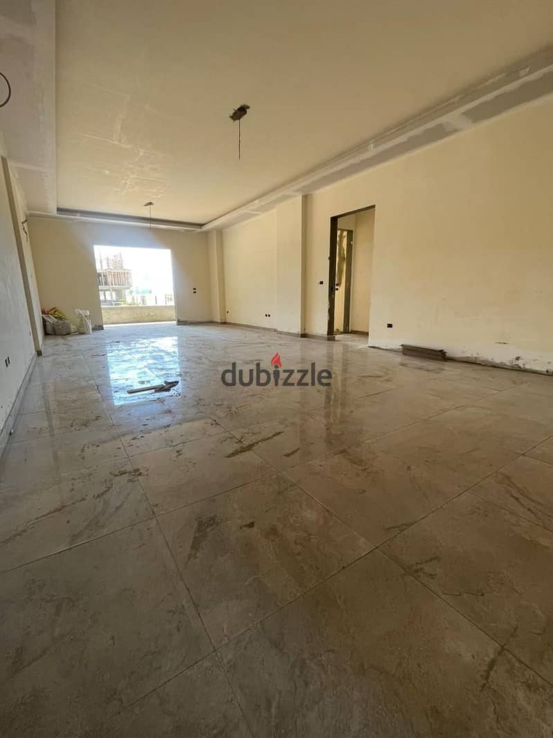 A fully finished apartment with a large area, with installments over 8 years, in the heart of old Sheikh Zayed, next to Karma Kay 17