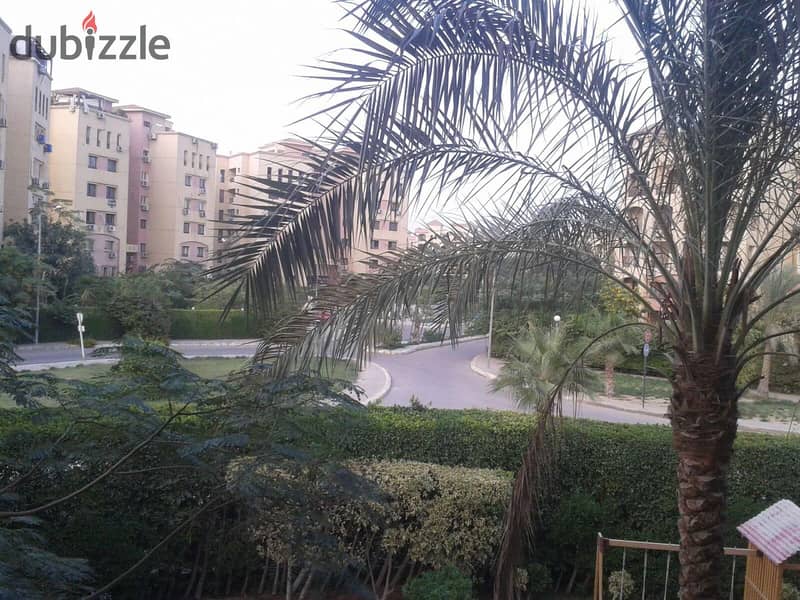 Apartment for sale with a garden in Al Ashgar Compound with a double view of green spaces and trees with the possibility of installments at the lowest 8