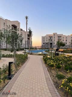 For sale, ground floor apartment in Garden Compound, October Plaza, Sodic, 6th of October City, next to Mountain View iCity