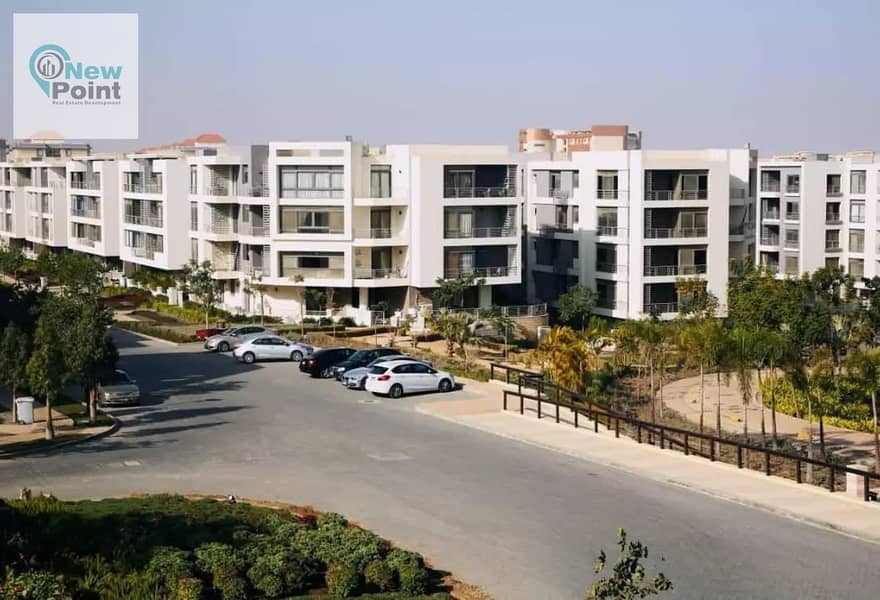 For sale, a 4-bedroom duplex in front of Gardenia in Taj City Compound, First Settlement 1