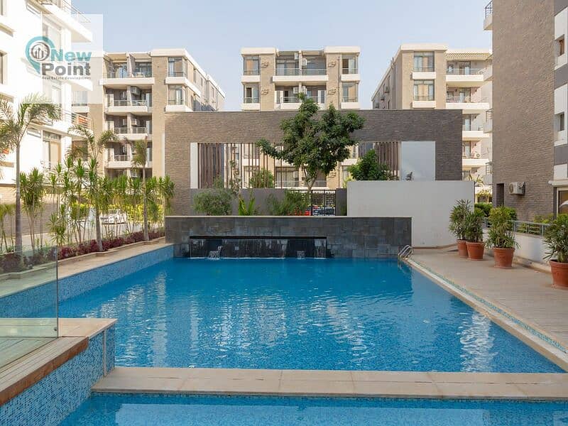 For sale, a 4-bedroom duplex in front of Gardenia in Taj City Compound, First Settlement 6