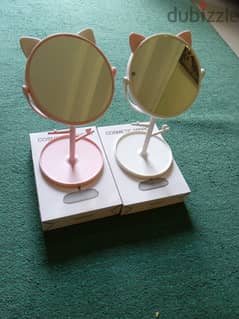 Two small rotatable beautiful mirrors with cat ears ornament and stand