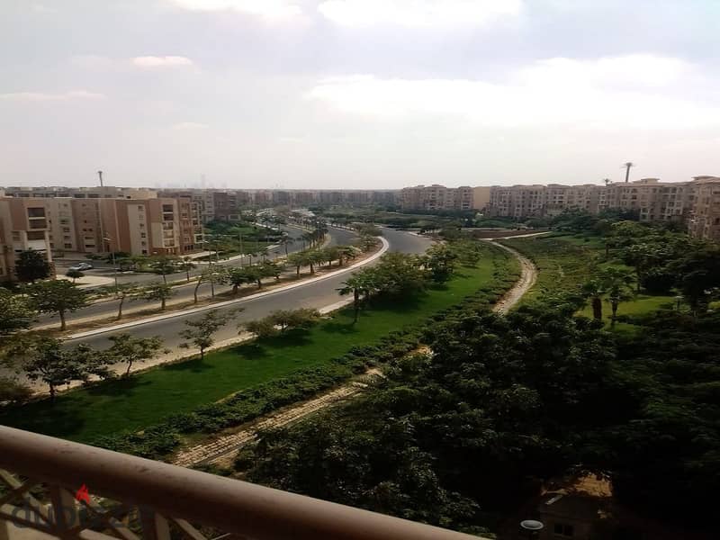 In Madinaty, an apartment for rent, 208 sqm, with an open view, will not be repeated, in front of the Food Court, the Club, and the Exhibition Market, 13