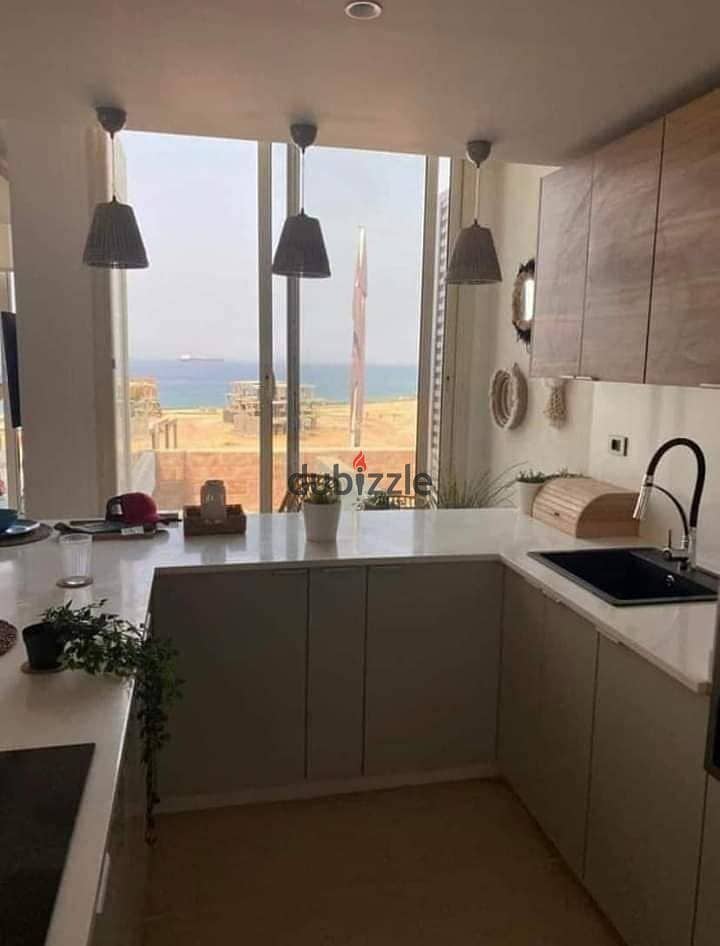 The last chalet to be delivered, 100 square meters on the sea, for sale in Ain Sokhna, in installments, The Groove, triple view, sea, lagoons and swim 3