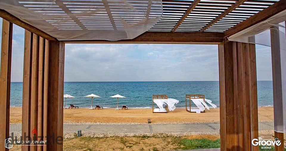 The last chalet to be delivered, 100 square meters on the sea, for sale in Ain Sokhna, in installments, The Groove, triple view, sea, lagoons and swim 5