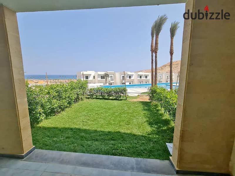 The last chalet to be delivered, 100 square meters on the sea, for sale in Ain Sokhna, in installments, The Groove, triple view, sea, lagoons and swim 9