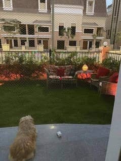 With a 42% discount, an apartment for sale, ground floor, in a garden, next to Madinaty, in a distinctive Saray Block compound in New Cairo. 0