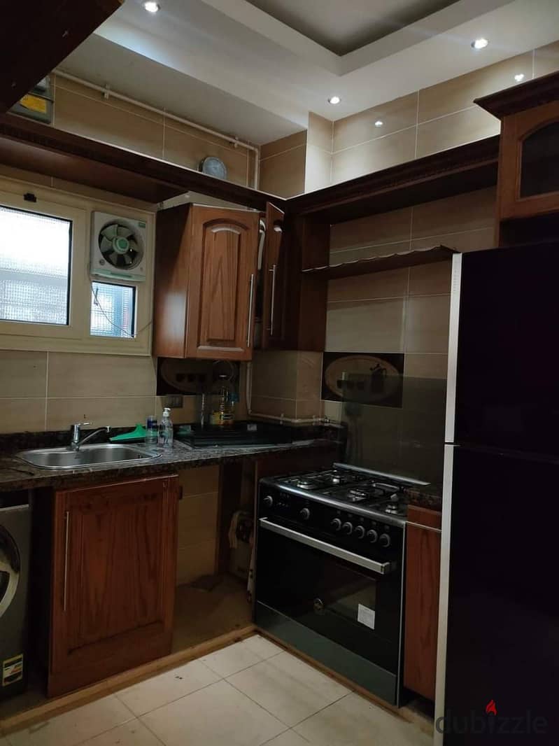 An apartment for sale with mattresses and appliances in Nakheel compound near Wadi Degla club 9